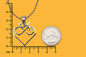 Cross pendant inside bicycle chain circle