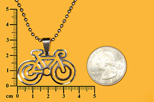 negative space bicycle pendant